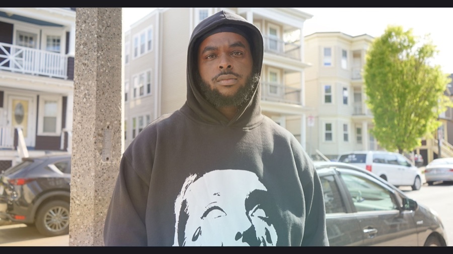Outdoor street portrait in a hoodie