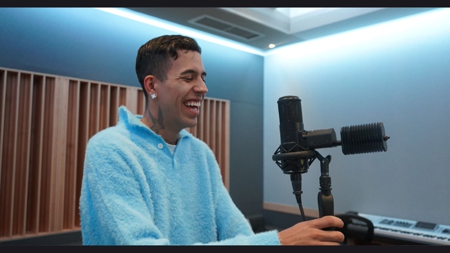 Artist laughing at the mic